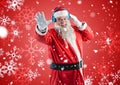 Happy santa claus listening to music on headphones Royalty Free Stock Photo