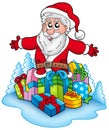 Happy Santa Claus with pile of gifts Royalty Free Stock Photo