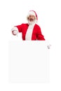 Happy Santa Claus pointing on blank advertisement banner background with copy space. Smiling Santa Claus pointing in Royalty Free Stock Photo