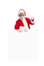 Happy Santa Claus pointing on blank advertisement banner background with copy space. Smiling Santa Claus pointing in Royalty Free Stock Photo