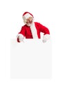 Happy Santa Claus pointing on blank advertisement banner background with copy space. Smiling Santa Claus pointing in Royalty Free Stock Photo