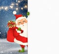 Happy Santa Claus standing behind a blank sign, showing on big blank sign. Cartoon Santa Claus character with gift bag Royalty Free Stock Photo