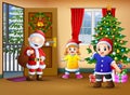 Happy santa and two kids in the living room with christmas tree Royalty Free Stock Photo
