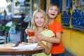 Happy or satisfied boy width girl eating pizza and Royalty Free Stock Photo