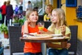 Happy or satisfied boy width girl eating pizza and Royalty Free Stock Photo