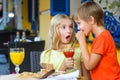 Happy or satisfied boy width girl eating pizza and Royalty Free Stock Photo