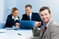 Happy satisfied businessman with colleagues Royalty Free Stock Photo