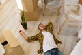 Happy man on floor moving new home Royalty Free Stock Photo