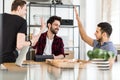 Happy and satisfied group of friends eating pizza after transact Royalty Free Stock Photo