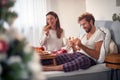 Happy, satisfied young couple having breakfast in bed after a great valentine night, eating, smiling, drinking coffee Royalty Free Stock Photo