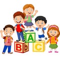 Happy school children with alphabet blocks