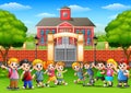 Happy school children in outside the front of school building Royalty Free Stock Photo