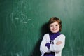 Happy school girl on math classes Royalty Free Stock Photo