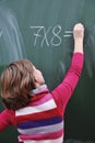 Happy school girl on math classes Royalty Free Stock Photo