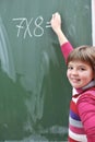 Happy school girl on math classes Royalty Free Stock Photo