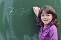Happy school girl on math classes Royalty Free Stock Photo