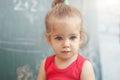 Happy school girl on math classes in kindergarten finding solution and solving problems Royalty Free Stock Photo