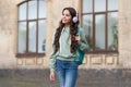 happy school girl in music headphones outdoor. school girl in music headphones outside. Royalty Free Stock Photo