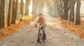 Happy girl riding bike in park Royalty Free Stock Photo