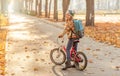 Happy girl riding bike in park Royalty Free Stock Photo