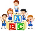 Happy school kids with alphabet blocks Royalty Free Stock Photo