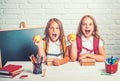 Happy school kids at lesson in september 1. Little girls eat apple at lunch break. School time of girls. Friendship of Royalty Free Stock Photo