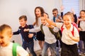 Happy school kids running in elementary school hallway, front view Royalty Free Stock Photo