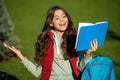 happy school teen girl read outdoor. school teen girl read outside. school teen girl read book. Royalty Free Stock Photo