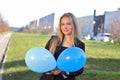 Happy school young girl with air baloons outdoor Royalty Free Stock Photo