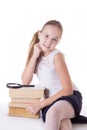 Happy schoolgirl with pile of books