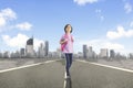 Happy schoolgirl standing on the highway Royalty Free Stock Photo