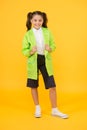 Happy schoolgirl wear raincoat. Invest in durable kids rainwear to keep children out in fresh air. Waterproof concept