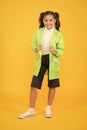 Happy schoolgirl wear raincoat. Invest in durable kids rainwear to keep children out in fresh air. Waterproof concept