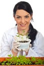 Happy scientist holding new cucumber plants Royalty Free Stock Photo