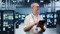 Happy scientist optimizes data center Royalty Free Stock Photo