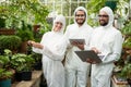 Happy scientists in clean suit using technologies Royalty Free Stock Photo