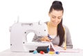 Happy seamstress sewing. isolated on the white