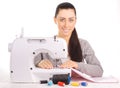 Happy seamstress sewing. isolated on the white