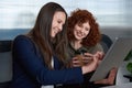 Happy, search or women friends on tablet for social media, reading blog or typing comment on news content on lunch break
