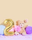 Happy second birthday. Number 2 party celebration with teddy bear, flower and balloons