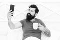 Happy selfie. Modern life new technology. Technology concept. Pleasant conversation. Good morning. Bearded man using Royalty Free Stock Photo