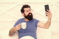 Happy selfie. Modern life new technology. Technology concept. Pleasant conversation. Good morning. Bearded man using Royalty Free Stock Photo