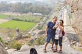 Happy Senior Adult couple Tourist clumbing up the steps at Gingee, Tamil Nadu, India