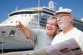 Happy Senior Adult Couple Tourists with Brochure by Cruise Ship