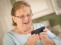 Senior Adult Woman Texting on Smart Cell Phone Royalty Free Stock Photo