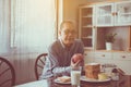 Happy senior asian man hands holding apple fresh fruit at home,Elderly healthy food concept Royalty Free Stock Photo