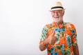 Happy senior bearded tourist man smiling while giving thumb up Royalty Free Stock Photo