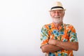 Happy senior bearded tourist man smiling while wearing Hawaii shirt Royalty Free Stock Photo