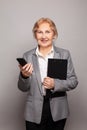 Happy senior business woman with smartphone portrait Royalty Free Stock Photo