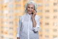 Happy senior business woman talking on mobile phone. Royalty Free Stock Photo